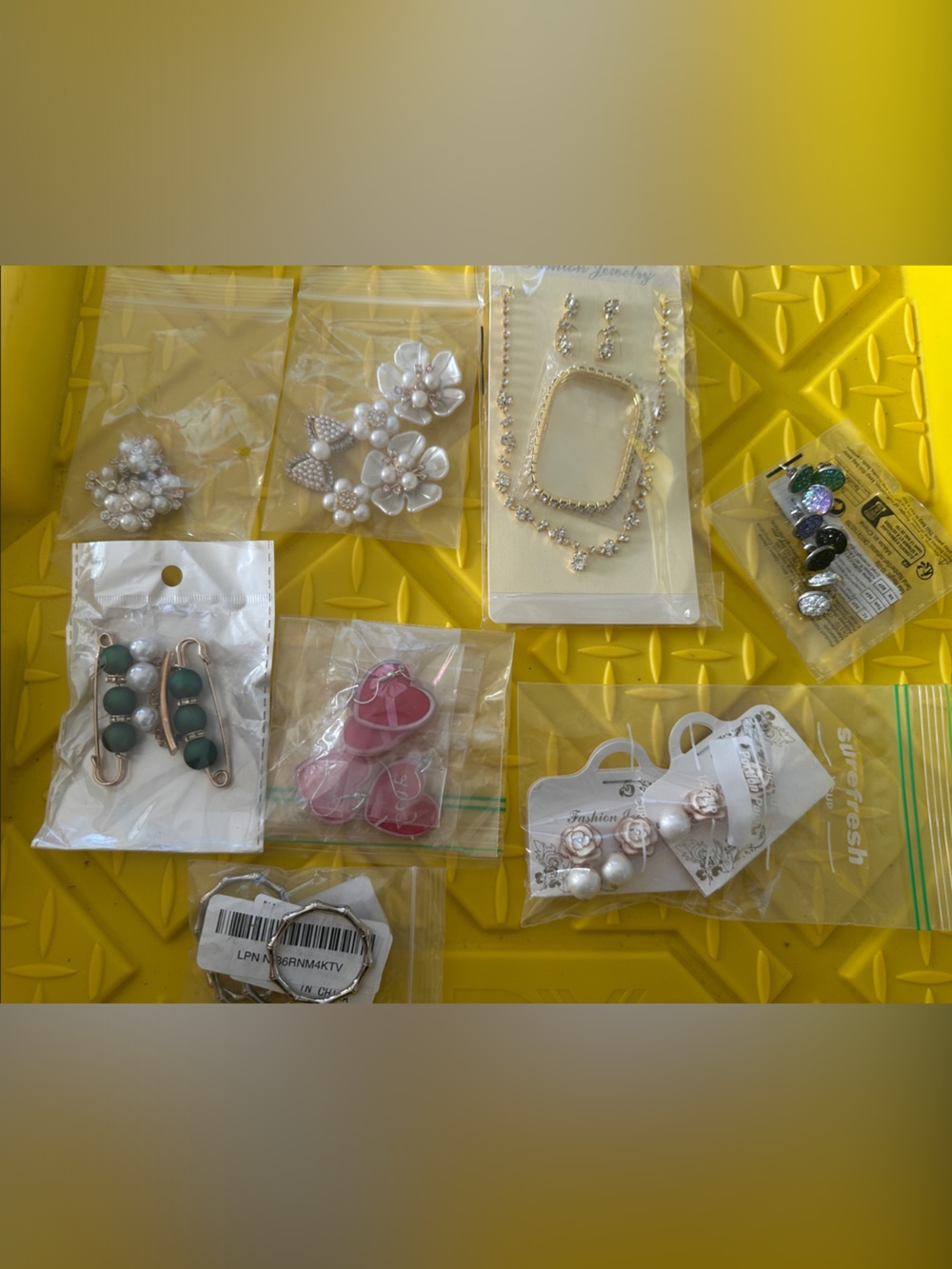 Assorted Lot of Jewelry, Earrings, Pins, Beads, and more